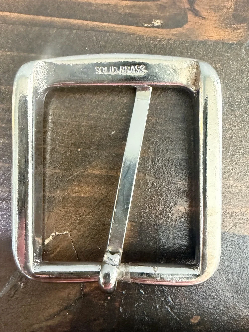 Lot of 6 Assorted Metal Belt Buckles with Leather Accent. One is Solid Brass.